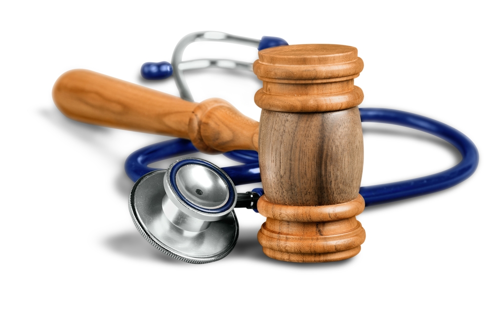 Top 3 Myths About Medical Malpractice - stethoscope and wooden gavel white background